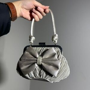 Sandra Robert’s VINTAGE Silver bow clutch bag with satin bow